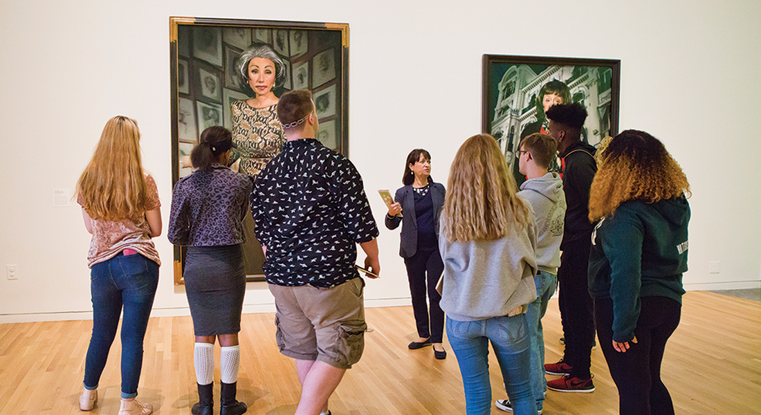 A Wexner Center volunteer docent leads a tour through the Cindy Sherman exhibition Imitation of Life