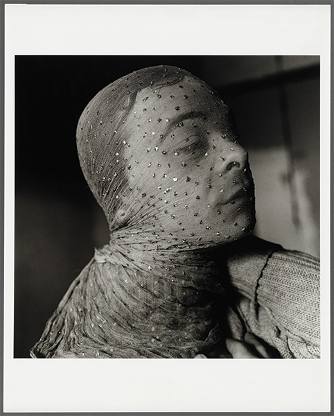 A 1981 photographic portrait of Gary Indiana under a sheer sequined scarf by Peter Hujar, entitled "Gary Indiana Veiled"