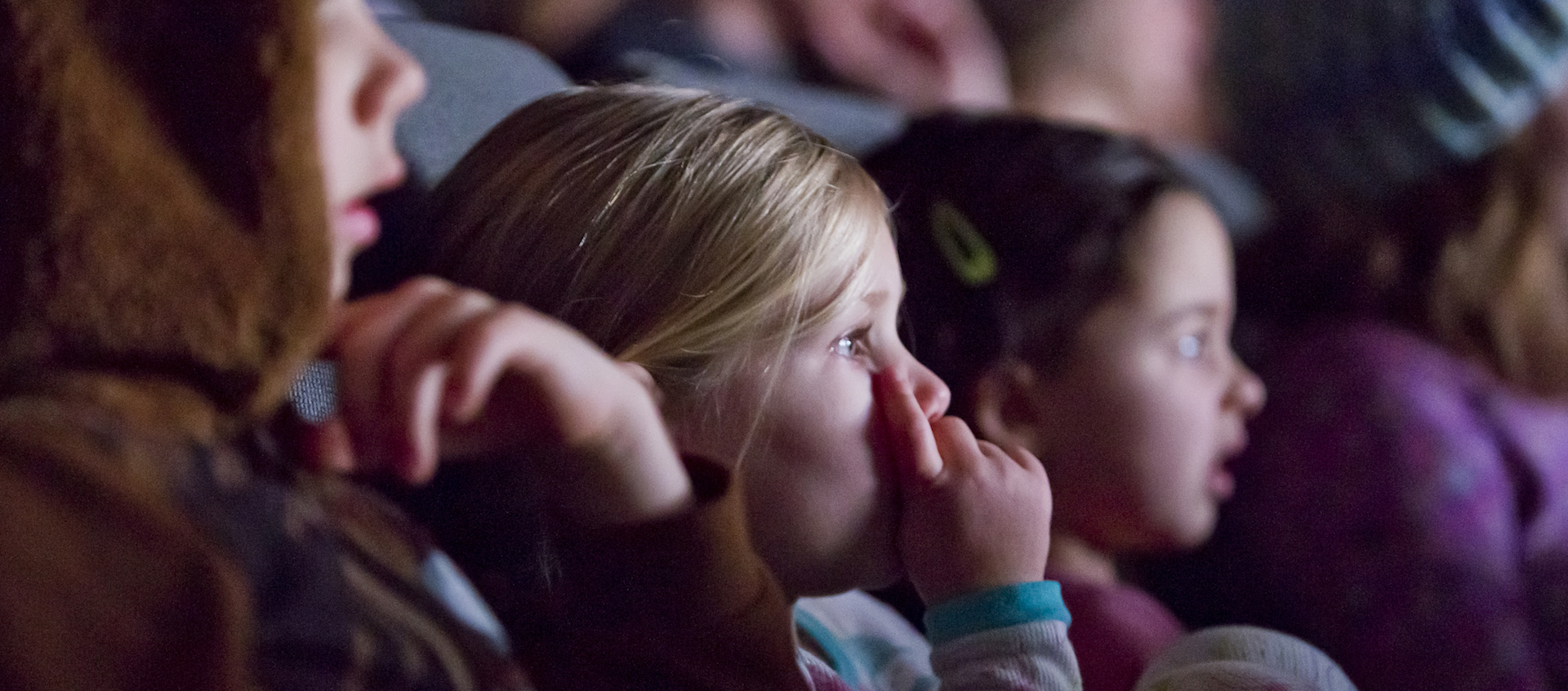 Young children watching a movie in the Wexner Center for the Arts Film/Video Theater during the Zoom: Family Film Festival in December 2017