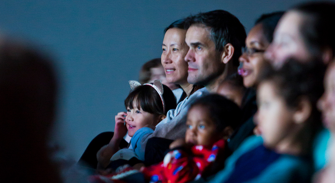 Parents with their children enjoy films at Zoom: Family Film Festival. 