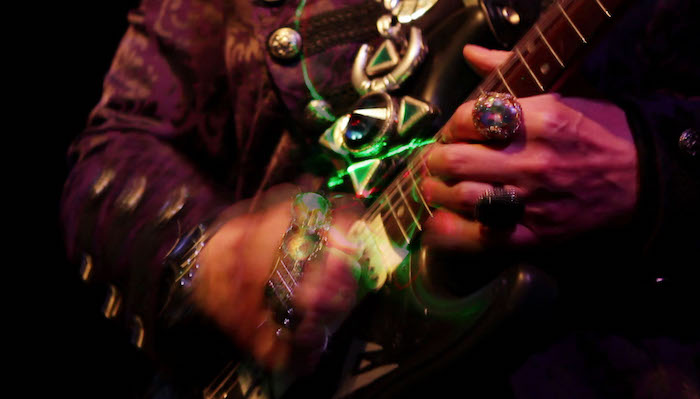 Image of hands playing an electric guitar from the Lori Felker Film Future Language: The Dimensions of VON LMO
