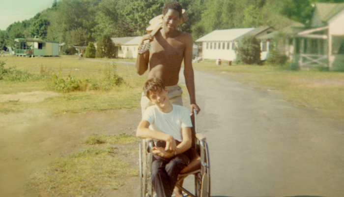 A vintage photograph of two campers with disabilities from the documentary Crip Camp