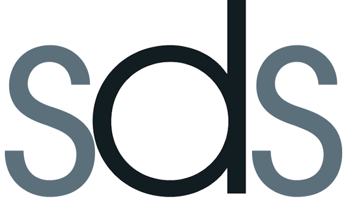 Three letter abbreviated logo for the Society of Disability Studies: a black "b" with a gray "s" on either side on a white background