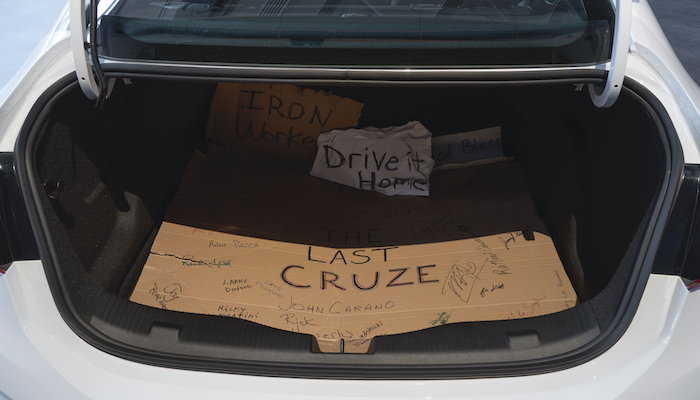 The interior of the truck of the last Chevy Cruze to be manufactured in Lordstown, Ohio, lined with handwritten signs from the workers who built it