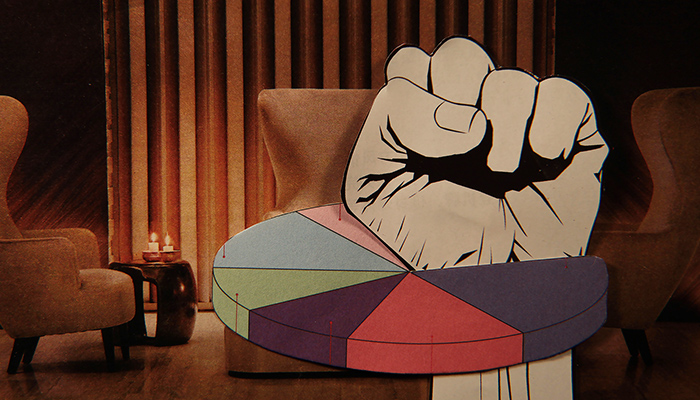 A paper fist punches through a pie chart with a vintage lounge setting as the background.