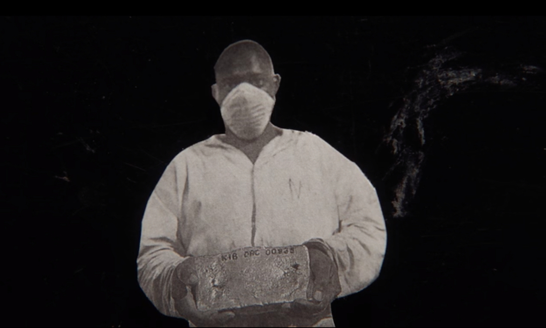 A man wearing an n95 mask and hazmat suit in a scene from Lewis Klahr's film Circumstantial Pleasures