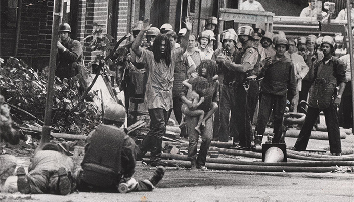 Image of police harassing member's of Philadelphia's MOVE from the documentary Let the Fire Burn