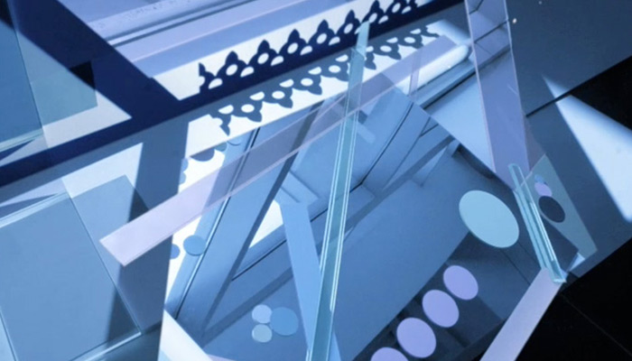 An abstract close-up of glass and metal architectural elements