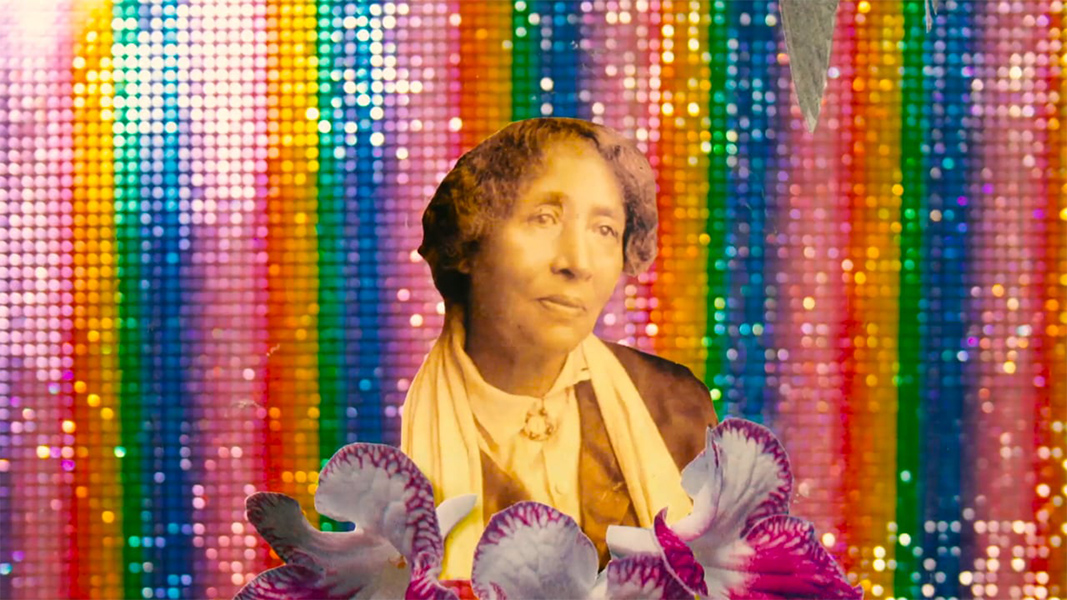 A collage of a photo go an old woman in sepia tones and cut-out images of purple and white flowers against a spangly rainbow background